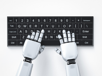 Two robot hands are typing on a keyboard